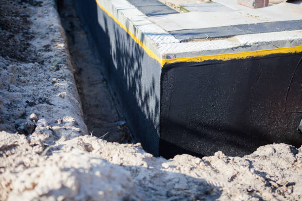 Professional Emergency Waterproofing technician working in Weston, MI